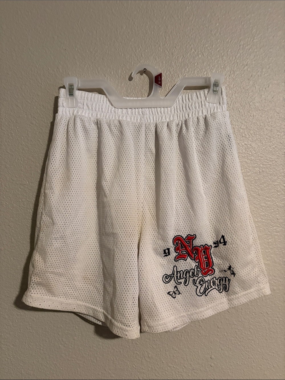 White Athletic Mesh Shorts with Red Script Accent